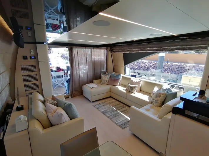Murano Yacht Photos Pics Luxurious interior of 2018 Azimut 72 FLY yacht with elegant seating and large windows.