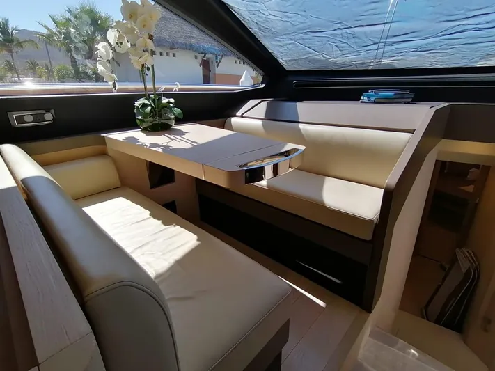 Murano Yacht Photos Pics Luxurious interior of 2018 Azimut 72 FLY yacht with elegant seating and table.