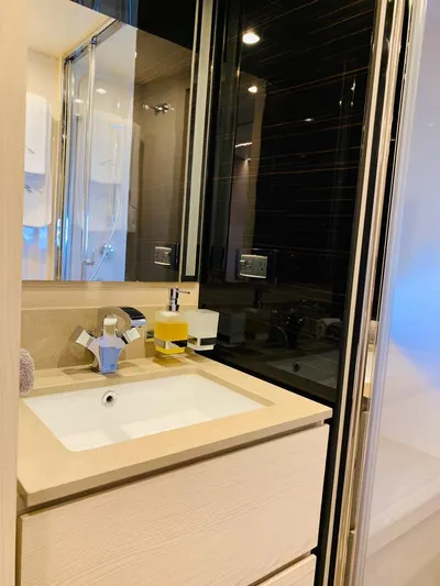 Murano Yacht Photos Pics Modern bathroom interior on 2018 Azimut 72 FLY yacht, featuring sleek sink and mirror.