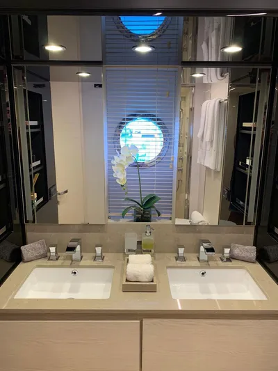Murano Yacht Photos Pics Luxurious bathroom on 2018 Azimut 72 FLY yacht with dual sinks and elegant decor.