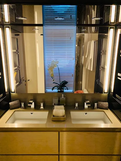 Murano Yacht Photos Pics Luxurious bathroom on 2018 Azimut 72 FLY yacht with dual sinks and elegant lighting.