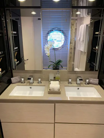 Murano Yacht Photos Pics Luxurious bathroom in 2018 Azimut 72 FLY yacht with dual sinks and elegant decor.