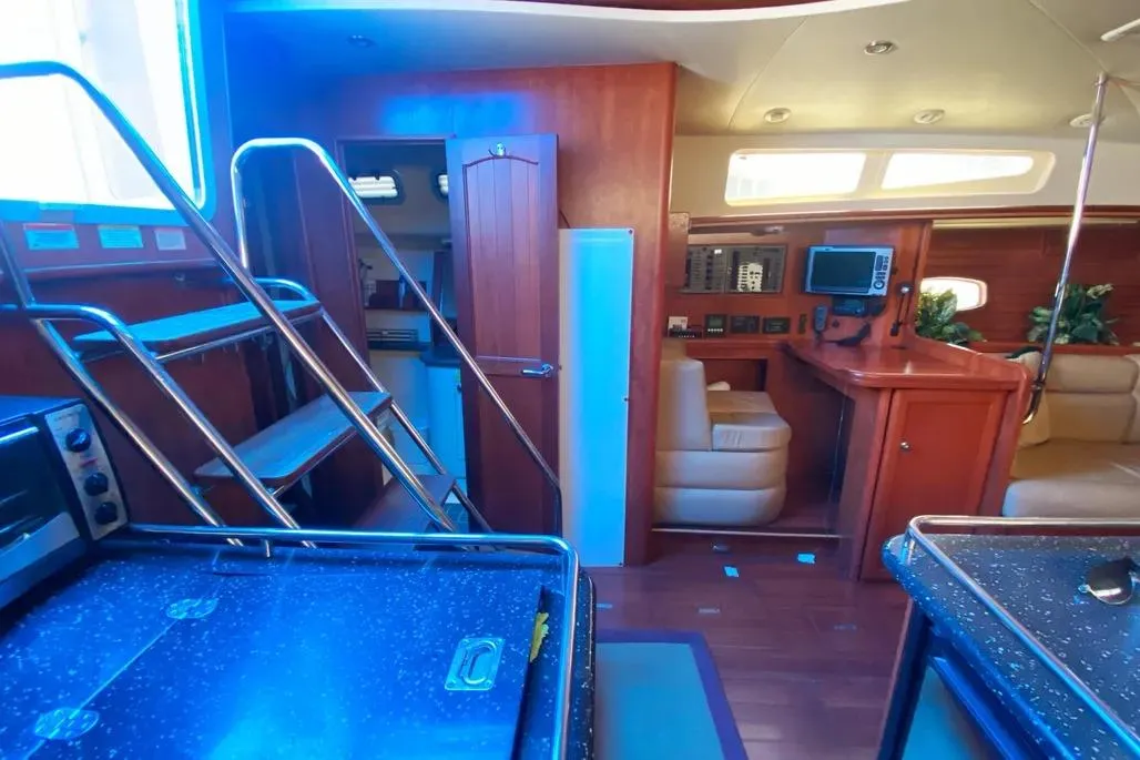 Interior of 2012 Hunter Aft Cockpit 50 yacht with modern amenities and wooden finishes.