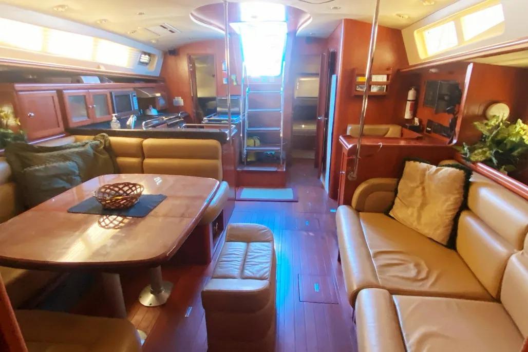 Luxurious interior of 2012 Hunter Aft Cockpit 50 yacht with elegant seating and dining area.