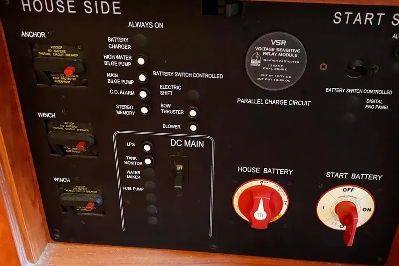 Pending Yacht Photos Pics Control panel of a 2012 Hunter Aft Cockpit 50 sailboat with various switches and dials.