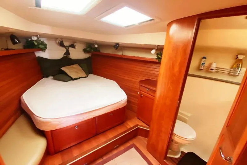 Pending Yacht Photos Pics Cozy cabin interior of 2012 Hunter Aft Cockpit 50 yacht with bed and bathroom.