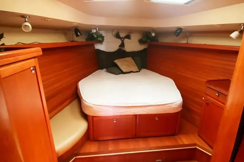 Pending Yacht Photos Pics Luxurious cabin interior of 2012 Hunter Aft Cockpit 50 yacht with cozy bed.
