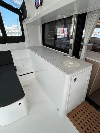  Yacht Photos Pics 2024 Lagoon 46 yacht interior with sleek white cabinetry and modern design elements.