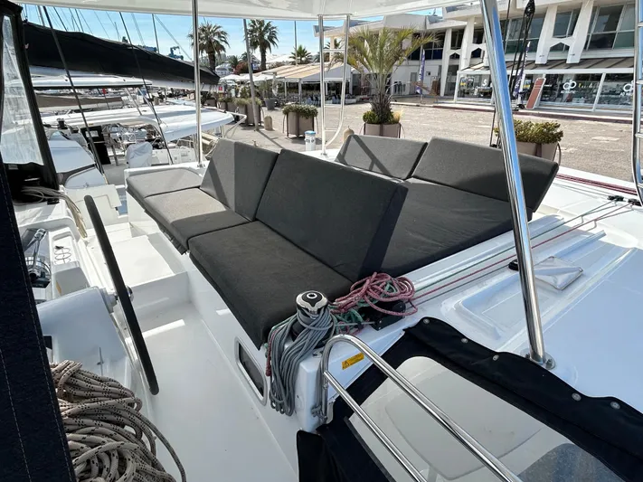  Yacht Photos Pics 2024 Lagoon 46 yacht with spacious seating area and modern design.