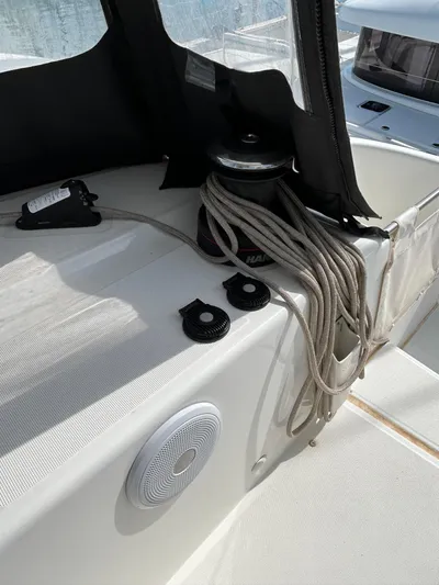  Yacht Photos Pics 2024 Lagoon 46 yacht deck with winch, ropes, and speaker.