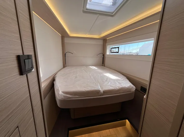  Yacht Photos Pics 2024 Lagoon 46 yacht cabin with modern design and ambient lighting.