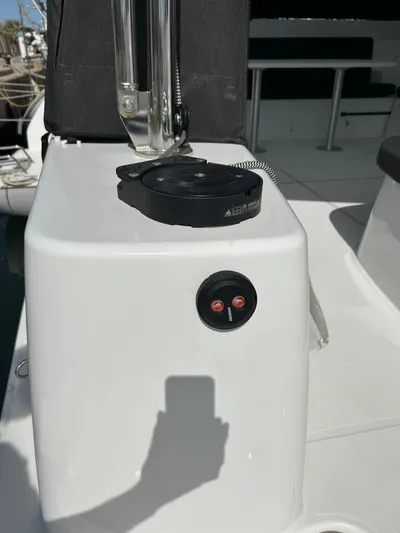  Yacht Photos Pics 2024 Lagoon 46 yacht deck with control panel and seating area.