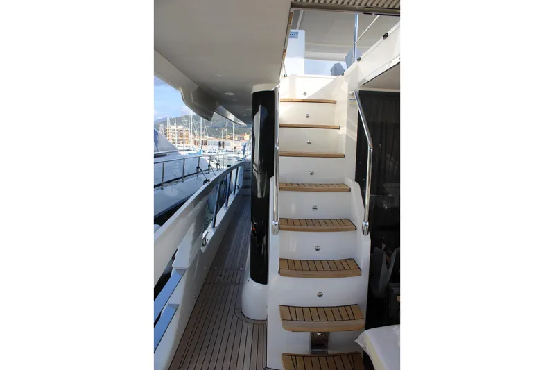  Yacht Photos Pics Staircase on Absolute NAVETTA 70 yacht, 2025 model, with sleek design and wooden steps.