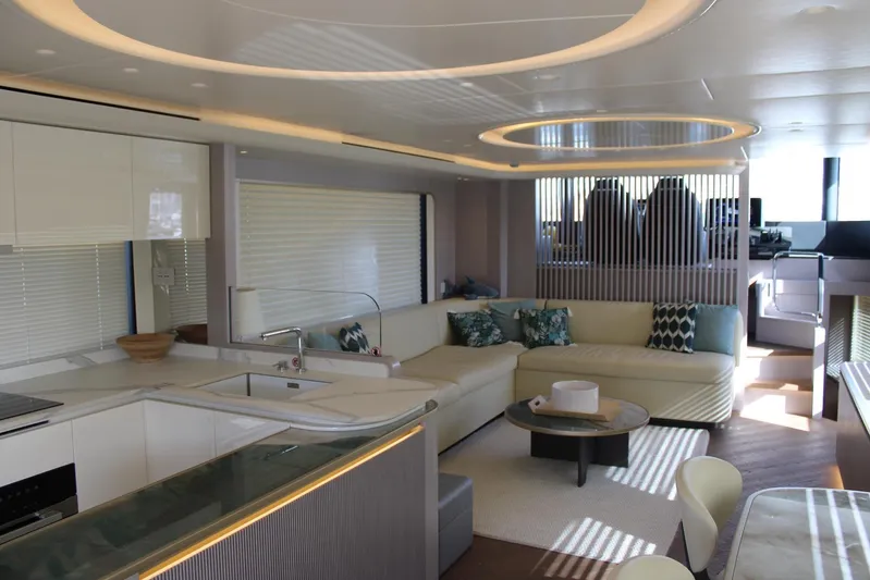  Yacht Photos Pics Luxurious interior of 2025 Absolute NAVETTA 70 yacht with modern kitchen and elegant seating area.