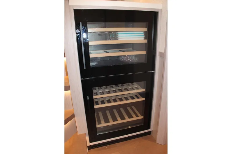  Yacht Photos Pics Modern wine cooler with wooden shelves on Absolute NAVETTA 70 yacht, 2025 model.