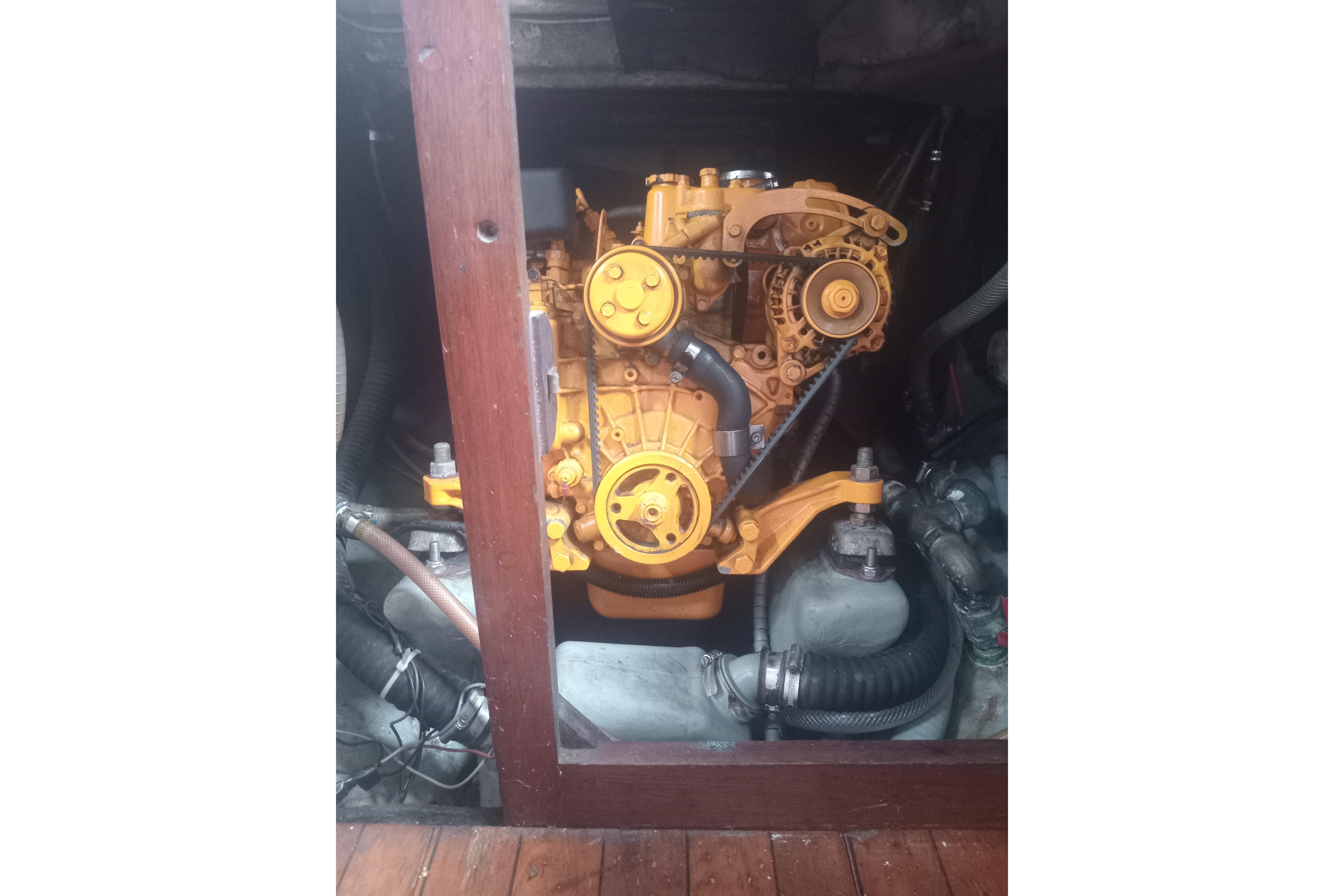 Engine of a 1965 Nicholson 32 sailboat, showcasing mechanical components.