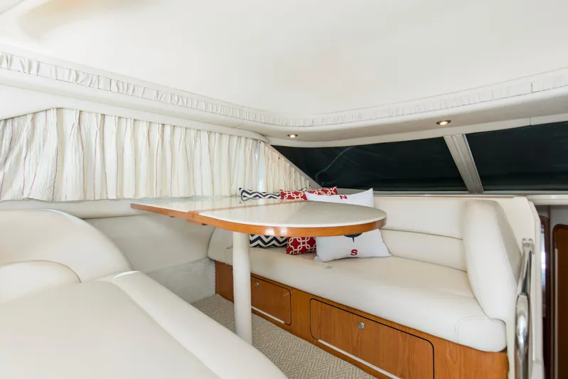 Silver Lining Yacht Photos Pics Interior of 2000 Sea Ray 400 Sedan Bridge with cozy seating and elegant table.