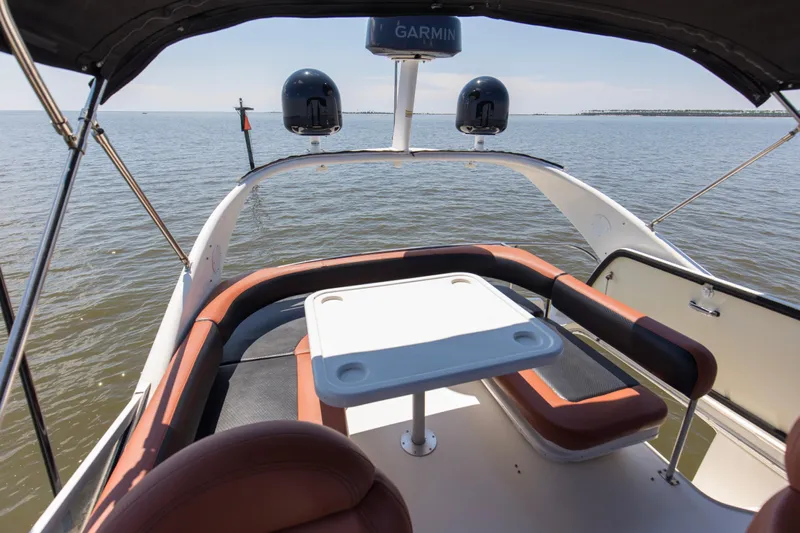 Silver Lining Yacht Photos Pics 2000 Sea Ray 400 Sedan Bridge boat with seating area and table on open water.