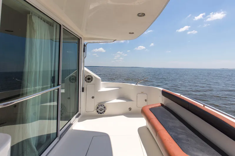 Silver Lining Yacht Photos Pics 2000 Sea Ray 400 Sedan Bridge yacht deck with ocean view and seating area.