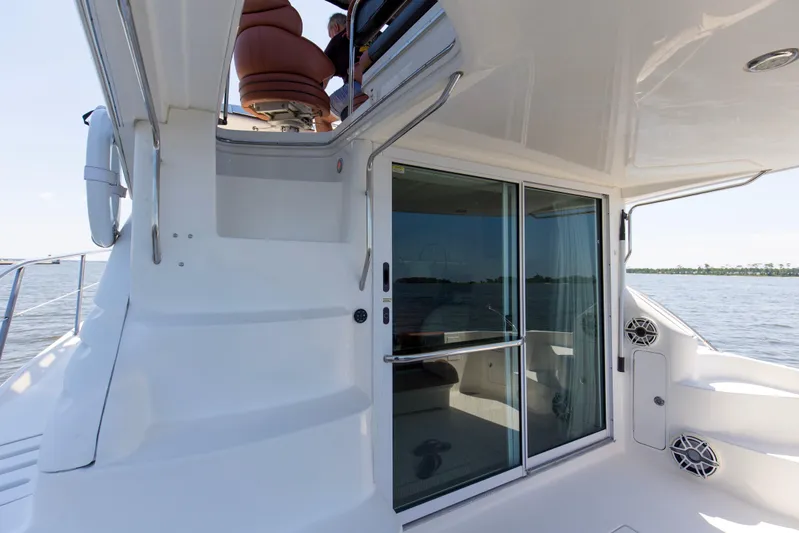 Silver Lining Yacht Photos Pics 2000 Sea Ray 400 Sedan Bridge yacht with sliding glass doors and upper deck seating.