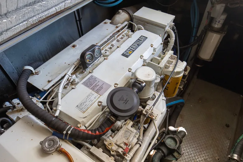 Silver Lining Yacht Photos Pics Engine room of 2000 Sea Ray 400 Sedan Bridge with Caterpillar engine components.