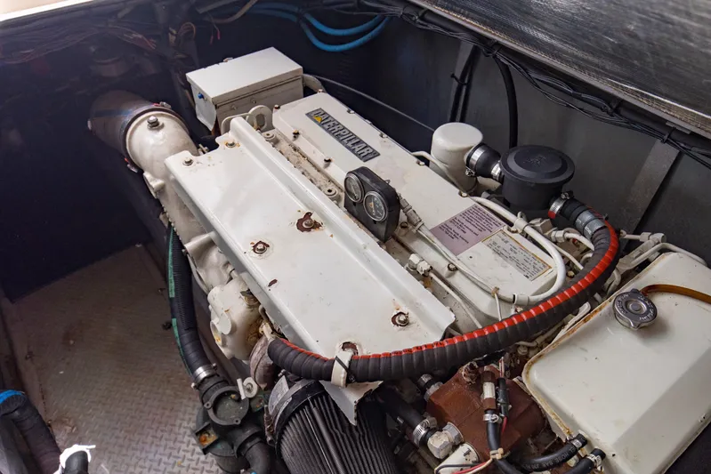Silver Lining Yacht Photos Pics Engine compartment of a 2000 Sea Ray 400 Sedan Bridge, featuring a detailed view of the engine.