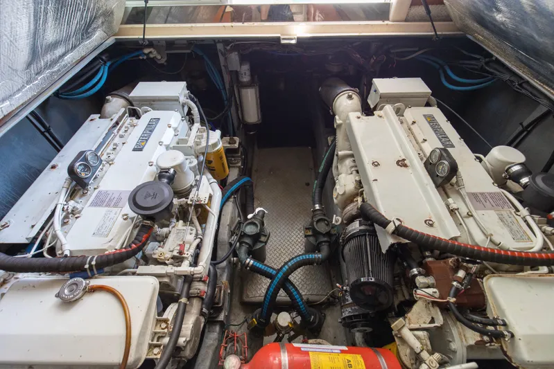 Silver Lining Yacht Photos Pics Engine room of a 2000 Sea Ray 400 Sedan Bridge with twin diesel engines.