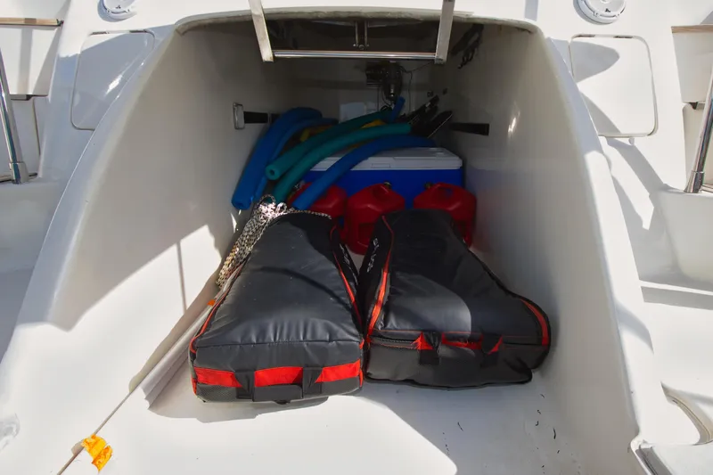 Julia Too Yacht Photos Pics Storage compartment of a 2002 Azimut 70 Sea Jet with bags and equipment.