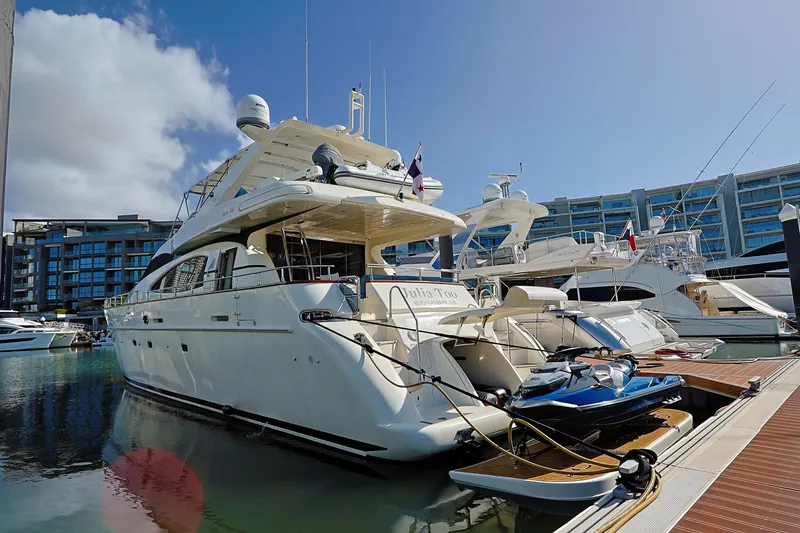 Julia Too Yacht Photos Pics Luxury 2002 Azimut 70 Sea Jet yacht docked in marina under clear blue sky.