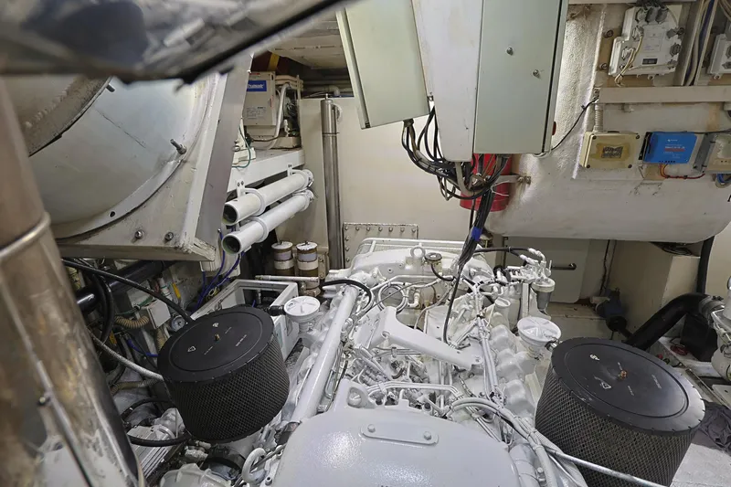 Julia Too Yacht Photos Pics Engine room of a 2002 Azimut 70 Sea Jet yacht, showcasing mechanical components and wiring.