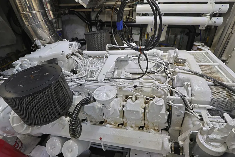 Julia Too Yacht Photos Pics Engine room of a 2002 Azimut 70 Sea Jet yacht, showcasing complex machinery.