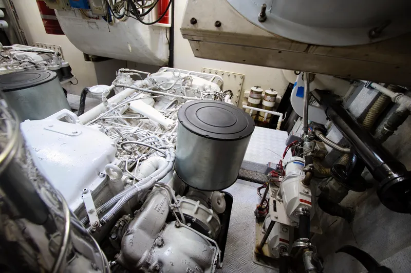 Julia Too Yacht Photos Pics Engine room of a 2002 Azimut 70 Sea Jet yacht, showcasing mechanical components.