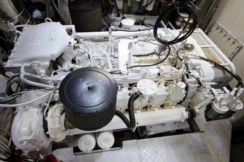 Julia Too Yacht Photos Pics Engine room of a 2002 Azimut 70 Sea Jet yacht, showcasing intricate machinery.