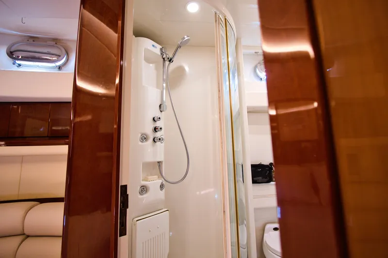 Julia Too Yacht Photos Pics Luxurious bathroom interior of 2002 Azimut 70 Sea Jet yacht with shower and toilet.