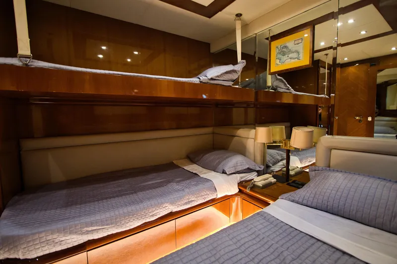 Julia Too Yacht Photos Pics Luxurious cabin interior of 2002 Azimut 70 Sea Jet yacht with cozy beds.