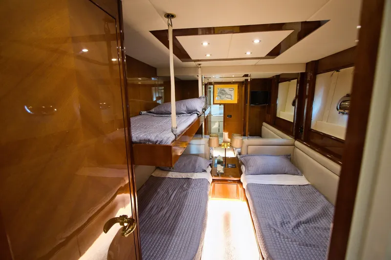 Julia Too Yacht Photos Pics Luxurious cabin interior of 2002 Azimut 70 Sea Jet yacht with cozy beds.