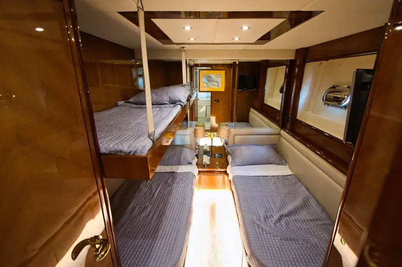 Julia Too Yacht Photos Pics Luxurious cabin interior of 2002 Azimut 70 Sea Jet yacht with cozy beds.