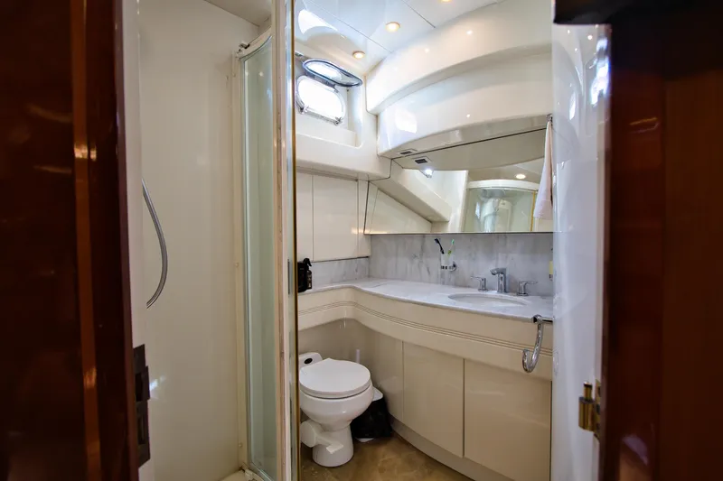 Julia Too Yacht Photos Pics Luxurious bathroom in 2002 Azimut 70 Sea Jet yacht with modern fixtures and elegant design.