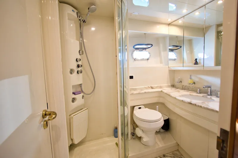 Julia Too Yacht Photos Pics Luxurious bathroom on 2002 Azimut 70 Sea Jet yacht with shower and marble countertop.