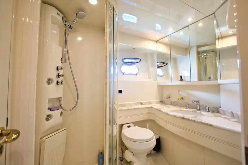 Julia Too Yacht Photos Pics Luxurious bathroom on 2002 Azimut 70 Sea Jet yacht with shower and marble countertop.