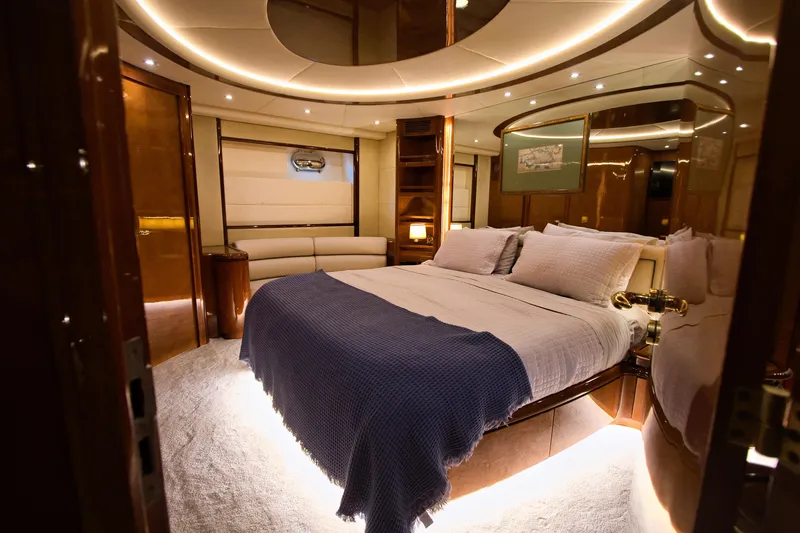 Julia Too Yacht Photos Pics Luxurious bedroom interior of 2002 Azimut 70 Sea Jet yacht with elegant lighting.