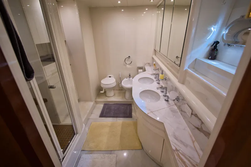 Julia Too Yacht Photos Pics Luxurious bathroom in 2002 Azimut 70 Sea Jet yacht with marble countertops and dual sinks.