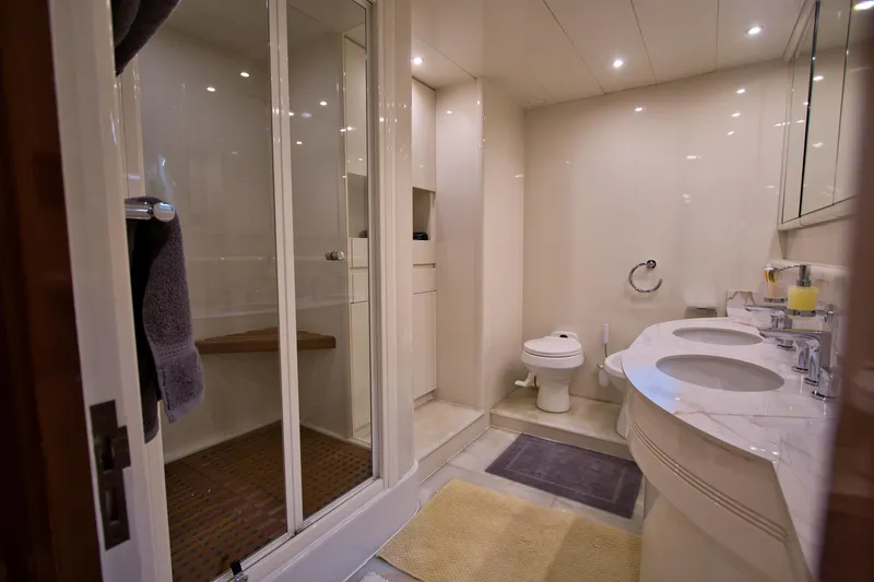 Julia Too Yacht Photos Pics Luxurious bathroom on 2002 Azimut 70 Sea Jet yacht with dual sinks and shower.