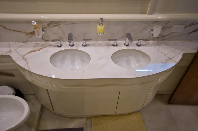 Julia Too Yacht Photos Pics Luxurious marble double sink vanity on 2002 Azimut 70 Sea Jet yacht bathroom.