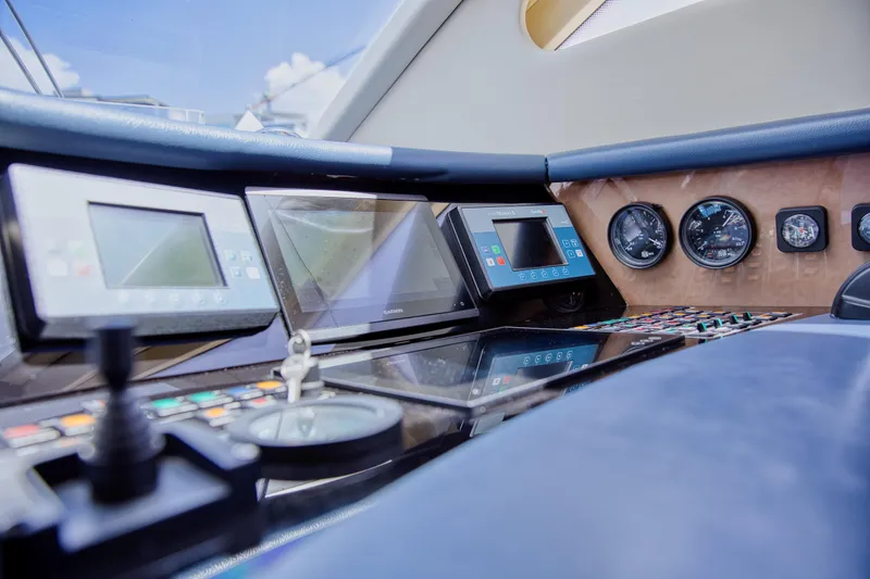 Julia Too Yacht Photos Pics Cockpit of 2002 Azimut 70 Sea Jet yacht with navigation instruments and controls.