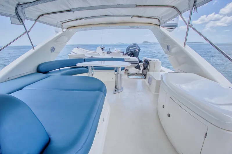 Julia Too Yacht Photos Pics Luxurious 2002 Azimut 70 Sea Jet yacht interior with blue seating and ocean view.