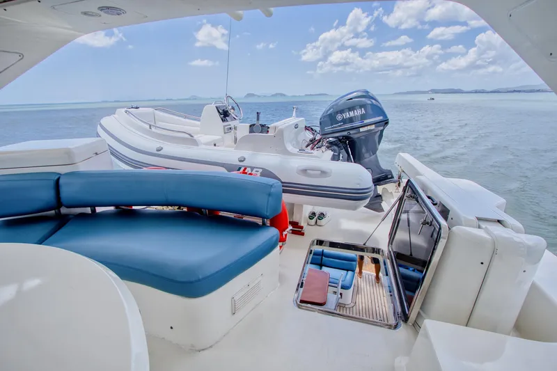 Julia Too Yacht Photos Pics Azimut 70 Sea Jet 2002 yacht deck with inflatable boat and Yamaha motor.