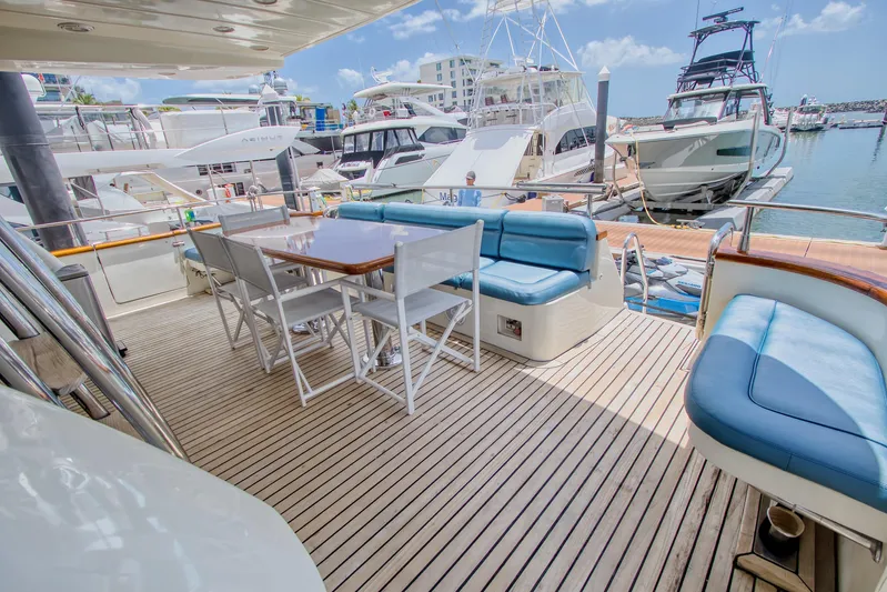 Julia Too Yacht Photos Pics Luxurious 2002 Azimut 70 Sea Jet yacht deck with seating and dining area at marina.