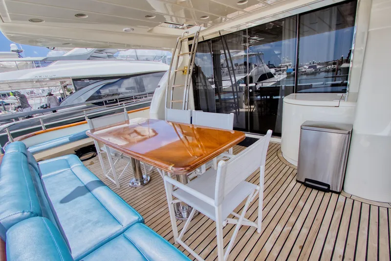 Julia Too Yacht Photos Pics Luxurious deck of 2002 Azimut 70 Sea Jet yacht with elegant seating and table.