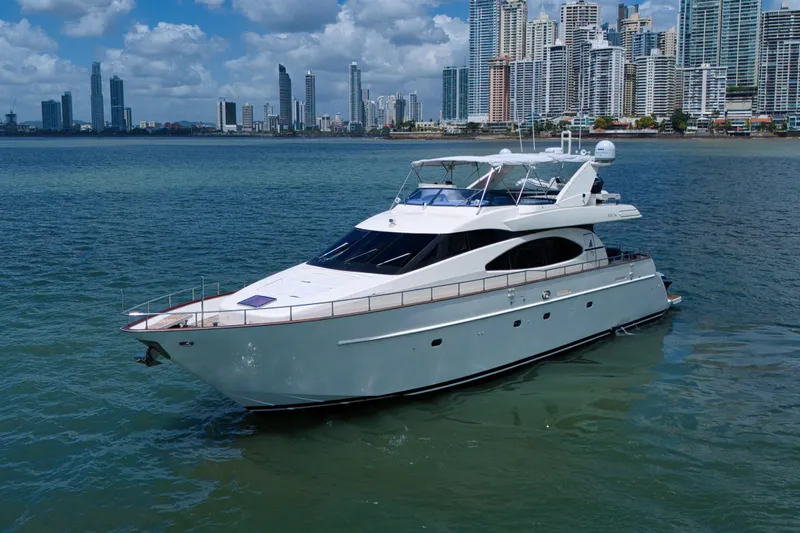 Julia Too Yacht Photos Pics Luxury 2002 Azimut 70 Sea Jet yacht cruising near city skyline.